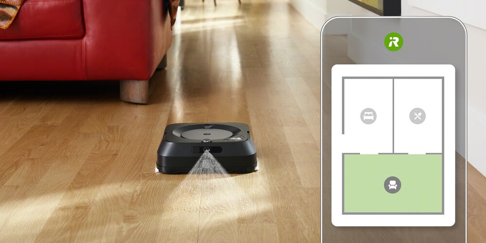 Ein schwarzer Braava Roboter und eine Smart Map auf einem Telefon